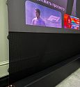 Моторизованный напольный ALR экран Global Screen OFM-100 124*221 Black Code UST 0.5 Perfo (Sale из шоу-рума с дефектом натяжения)